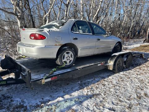 Cash ForCars | Junk Car on Trailer for Scrap Metal Recycling